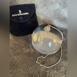 Preowned Bailey Banks and Biddle Unicorn Key pendant necklace